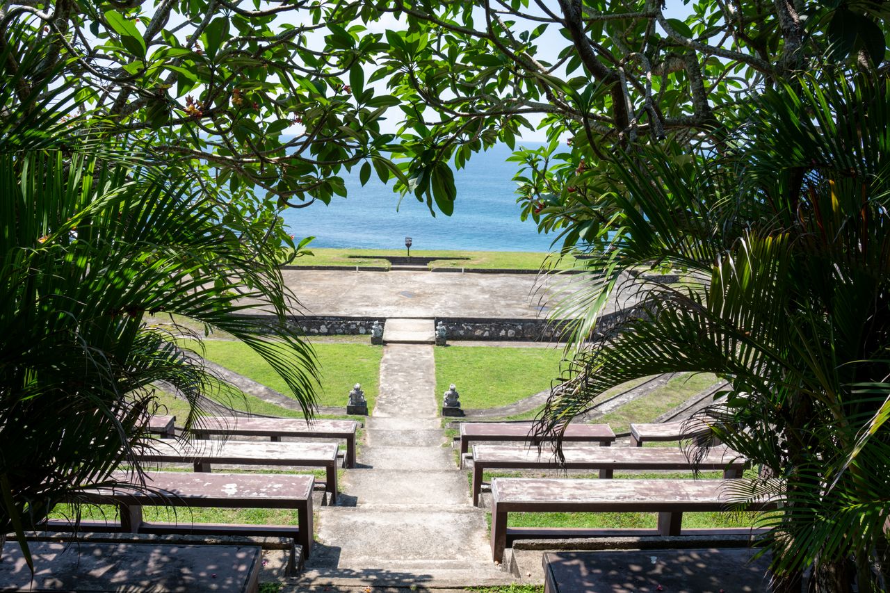 Mastering the First Impression: Your intriguing post title goes here Beautiful amphitheater with ocean view framed by lush greenery in Bali.